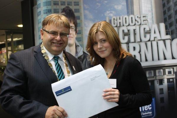 Lower Hutt Mayor Ray Wallace presents Patricia Ramsden with a Hutt City Centennial scholarship certificate to assist with her Weltec studies.